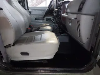 1998 Jeep Wrangler SE with VIN 1J4FY29P2WP733255, listed as a IAAI auction lot 41554602 with 157,316 mi miles. Bid and sale history available at carsss.com. Image 5.