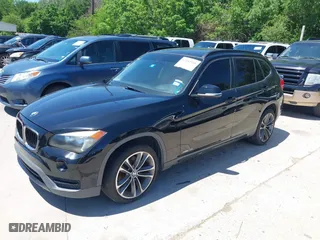 2014 BMW X1 sDrive28i with VIN WBAVM1C5XEVW51666, listed as a IAAI auction lot 42083936 with 176,465 mi miles. Bid and sale history available at carsss.com. Image 2.