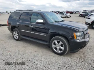 2014 Chevrolet Tahoe LTZ with VIN 1GNSKCE0XER228028, listed as a Copart auction lot 56971135 with 155,285 mi miles and Salvage title. Bid and sale history available at DreamBid. Image 4.