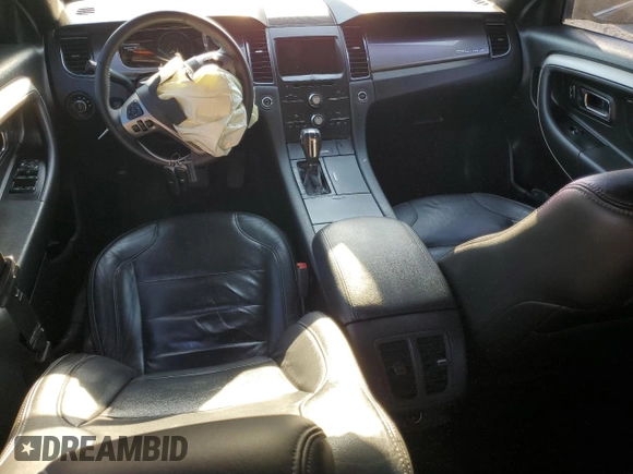 2015 Ford Taurus SEL z VIN 1FAHP2E85FG151155, wystawiony jako Copart lot #77791634 z przebiegiem 224 144 mil mil oraz Szkody całkowita. Historia ofert i sprzedaży dostępna na DreamBid. Obrazek 8.