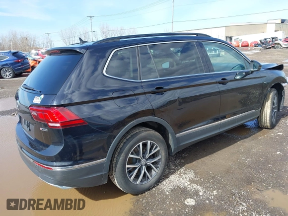 2020 Volkswagen Tiguan SE with VIN 3VV2B7AX5LM091857, listed as a IAAI auction lot 41922727 with 83,464 mi miles and . Bid and sale history available at DreamBid. Image 4.