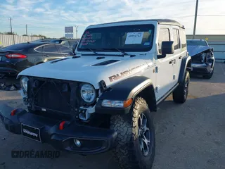 2022 Jeep Wrangler Unlimited Rubicon with VIN 1C4HJXFN4NW123803, listed as a IAAI auction lot 40994742 with 36,156 mi miles and . Bid and sale history available at DreamBid. Image 17.
