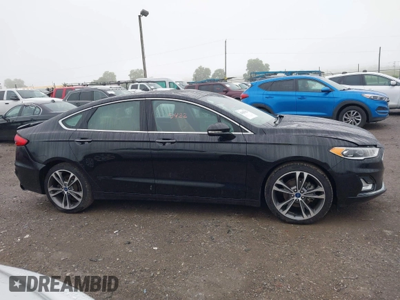 2019 Ford Fusion Titanium with VIN 3FA6P0D92KR125864, listed as a IAAI auction lot 42425422 with 109,340 mi miles and . Bid and sale history available at DreamBid. Image 13.