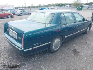 1999 Cadillac DeVille DHS with VIN 1G6KE54Y9XU766791, listed as a IAAI auction lot 42005553 with 140,515 mi miles. Bid and sale history available at carsss.com. Image 4.
