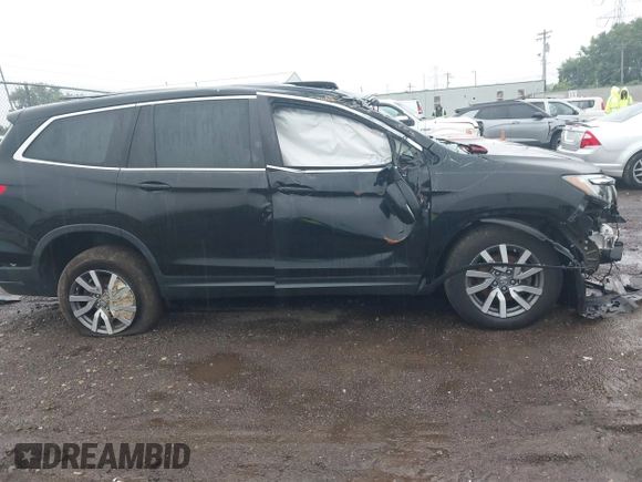 2021 Honda Pilot EX-L with VIN 5FNYF6H59MB021022, listed as a IAAI auction lot 42713636 with Not provided miles and . Bid and sale history available at DreamBid. Image 13.