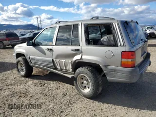 1998 Jeep Grand Cherokee Laredo with VIN 1J4GZ58S7WC316522, listed as a Copart auction lot 80201994 with 217,465 mi miles and Clean Title. Bid and sale history available at carsss.com. Image 2.