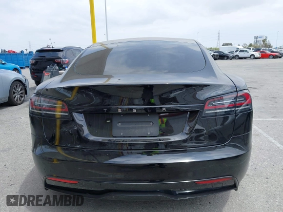 2023 Tesla Model S with VIN 5YJSA1E52PF528795, listed as a IAAI auction lot 42110660 with 21,243 mi miles and . Bid and sale history available at DreamBid. Image 16.
