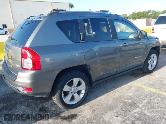2011 Jeep Compass with VIN 1J4NT1FA4BD213994, listed as a IAAI auction lot 42020375 with 84,409 mi miles. Bid and sale history available at carsss.com. Image 4.