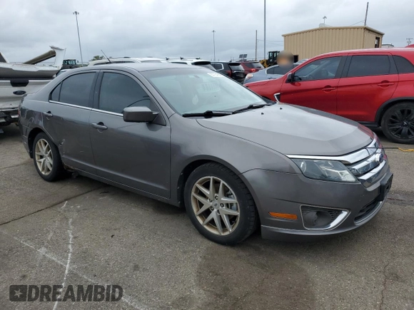 2012 Ford Fusion SEL z VIN 3FAHP0JA2CR232860, wystawiony jako Copart lot #57754735 z przebiegiem 234 638 mil mil oraz Szkody całkowita. Historia ofert i sprzedaży dostępna na DreamBid. Obrazek 4.