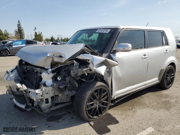 2012 Scion xB with VIN JTLZE4FE3C1143496, listed as a Copart auction lot 52157215 with 223,376 mi miles and Salvage Title. Bid and sale history available at carsss.com. Image 1.