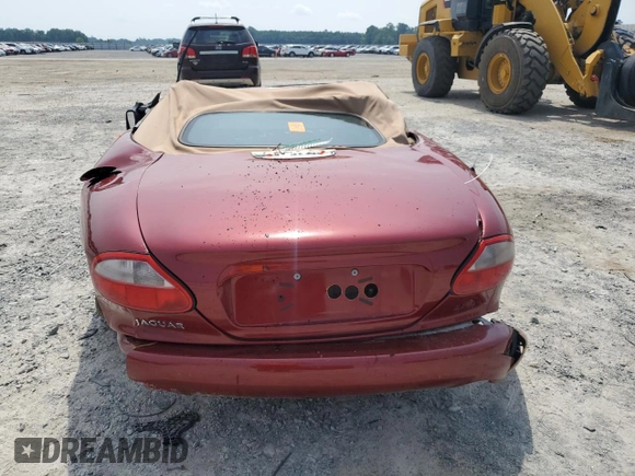 1999 Jaguar XK with VIN SAJGX204XXC038435, listed as a Copart auction lot 64843714 with Not Provided miles and Salvage Title. Bid and sale history available at DreamBid. Image 6.