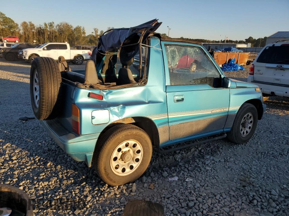 1992 Suzuki Sidekick z VIN 2S3TC01C2N6405497, wystawiony jako Copart lot #75856164 z przebiegiem 38 423 mil mil oraz Szkody całkowita. Historia ofert i sprzedaży dostępna na DreamBid. Obrazek 3.