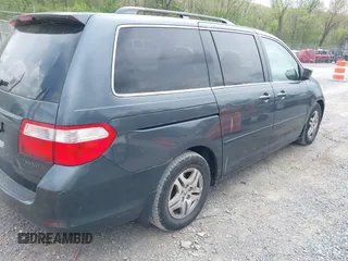 2005 Honda Odyssey EX with VIN 5FNRL38495B004614, listed as a IAAI auction lot 42128185 with 230,247 mi miles. Bid and sale history available at carsss.com. Image 4.