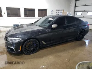 2020 BMW 5 Series M550i xDrive z VIN WBAJS7C07LBN96474, wystawiony jako Copart lot #50143895 z przebiegiem 58 146 mil mil oraz Czysty tytuł • Clean title. Historia ofert i sprzedaży dostępna na DreamBid. Obrazek 1.