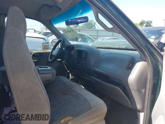 1999 Ford F-150 XL z VIN 2FTRX18L9XCA01139, wystawiony jako IAAI lot #42550053 z przebiegiem 263 950 mil mil oraz . Historia ofert i sprzedaży dostępna na DreamBid. Obrazek 5.