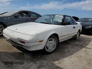 1986 Toyota MR2 z VIN JT2AW15C7G0083196, wystawiony jako Copart lot #74149374 z przebiegiem 30 771 mil mil oraz Nie do naprawy. Historia ofert i sprzedaży dostępna na DreamBid. Obrazek 1.