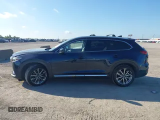 2016 Mazda CX-9 Grand Touring with VIN JM3TCADY6G0107064, listed as a IAAI auction lot 42580485 with 124,713 mi miles and . Bid and sale history available at DreamBid. Image 15.