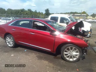 2014 Cadillac XTS Luxury z VIN 2G61N5S36E9177310, wystawiony jako IAAI lot #37249192 z przebiegiem 109 941 mil mil oraz . Historia ofert i sprzedaży dostępna na DreamBid. Obrazek 1.