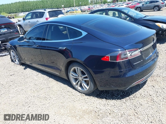 2014 Tesla Model S 60 with VIN 5YJSA1H18EFP31969, listed as a IAAI auction lot 42312485 with 90,043 mi miles and . Bid and sale history available at DreamBid. Image 3.