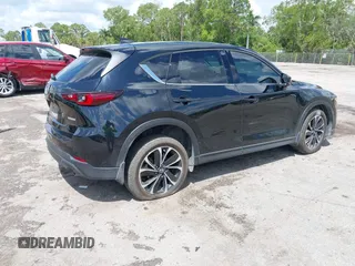 2023 Mazda CX-5 2.5 S Premium Plus Package with VIN JM3KFBEM5P0256652, listed as a IAAI auction lot 41936376 with 31,332 mi miles. Bid and sale history available at carsss.com. Image 4.