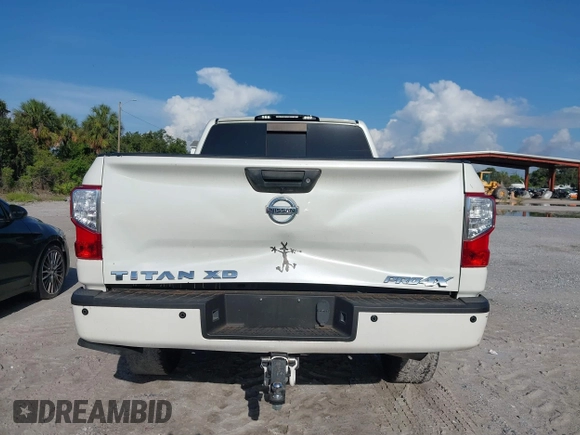 2016 Nissan Titan Platinum Reserve with VIN 1N6BA1F4XGN517905, listed as a IAAI auction lot 42676671 with 110,004 mi miles and . Bid and sale history available at DreamBid. Image 16.