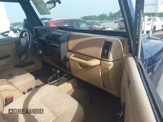 2002 Jeep Wrangler Sport with VIN 1J4FA49S72P729703, listed as a IAAI auction lot 42468446 with 164,342 mi miles and . Bid and sale history available at DreamBid. Image 5.