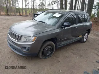 2011 Jeep Compass Latitude with VIN 1J4NF1FB5BD264825, listed as a IAAI auction lot 41935691 with 166,184 mi miles. Bid and sale history available at carsss.com. Image 2.