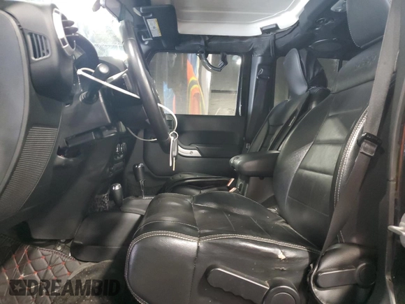 2012 Jeep Wrangler Unlimited Sahara with VIN 1C4BJWEG8CL235893, listed as a Copart auction lot 58195585 with 142,179 mi miles and Salvage title. Bid and sale history available at DreamBid. Image 7.