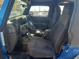 2003 Jeep Wrangler Sport z VIN 1J4FA49S53P350281, wystawiony jako Copart lot #56634005 z przebiegiem 158 974 mil mil oraz Szkoda całkowita • Salvage title. Historia ofert i sprzedaży dostępna na DreamBid. Obrazek 7.