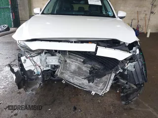 2019 Mazda CX-5 Grand Touring with VIN JM3KFBDMXK0648813, listed as a IAAI auction lot 42524680 with 23,521 mi miles and . Bid and sale history available at DreamBid. Image 6.