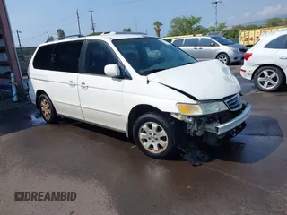 2002 Honda Odyssey EX z VIN 2HKRL18632H556791, wystawiony jako IAAI lot #41562553 z przebiegiem 222 976 mil mil oraz . Historia ofert i sprzedaży dostępna na DreamBid. Obrazek 1.