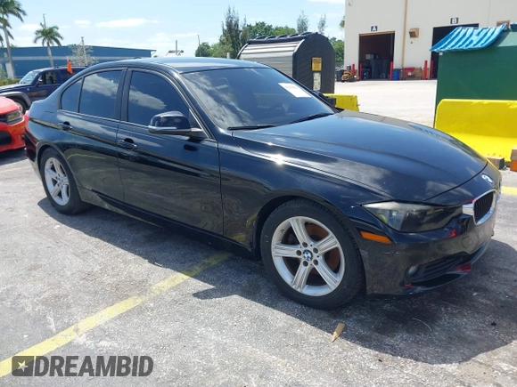2014 BMW 3 Series 320i with VIN WBA3B1C55EK135357, listed as a IAAI auction lot 42158550 with 148,911 mi miles. Bid and sale history available at carsss.com. Image 1.