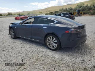 2014 Tesla Model S 60 with VIN 5YJSA1S12EFP29885, listed as a Copart auction lot 59769215 with Not provided miles and Salvage title. Bid and sale history available at DreamBid. Image 2.