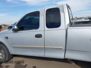 2001 Ford F-150 XL z VIN 1FTRX17W61NA73638, wystawiony jako IAAI lot #41543338 z przebiegiem Nie podano mil oraz . Historia ofert i sprzedaży dostępna na DreamBid. Obrazek 14.