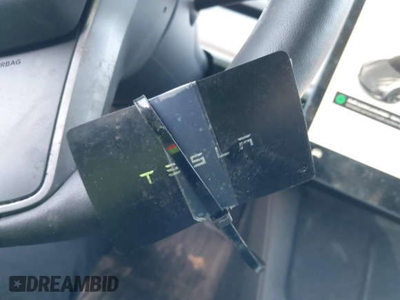 2023 Tesla Model 3 with VIN 5YJ3E1EAXPF666252, listed as a IAAI auction lot 42009929 with 27,328 mi miles and . Bid and sale history available at DreamBid. Image 11.