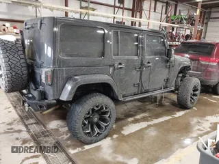 2015 Jeep Wrangler Unlimited Sahara with VIN 1C4BJWEG6FL688382, listed as a IAAI auction lot 41620621 with 138,119 mi miles. Bid and sale history available at carsss.com. Image 4.