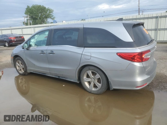 2018 Honda Odyssey EX-L with VIN 5FNRL6H74JB099282, listed as a Copart auction lot 55031025 with 137,359 mi miles and Salvage Title. Bid and sale history available at DreamBid. Image 2.