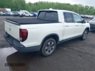 2019 Honda Ridgeline RTL-E with VIN 5FPYK3F75KB020713, listed as a IAAI auction lot 42191152 with 31,245 mi miles and . Bid and sale history available at DreamBid. Image 4.
