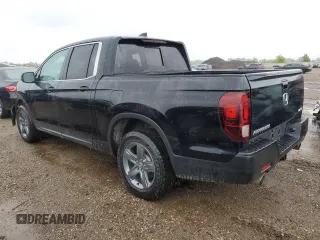 2023 Honda Ridgeline RTL with VIN 5FPYK3F59PB001216, listed as a Copart auction lot 57147385 with 43,452 mi miles and Salvage title. Bid and sale history available at DreamBid. Image 2.