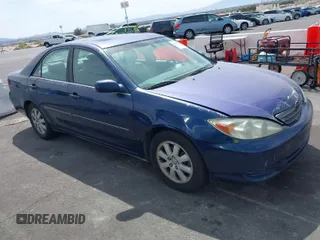 2002 Toyota Camry XLE z VIN 4T1BF30K32U512336, wystawiony jako IAAI lot #41988909 z przebiegiem 235 830 mil mil oraz . Historia ofert i sprzedaży dostępna na DreamBid. Obrazek 1.