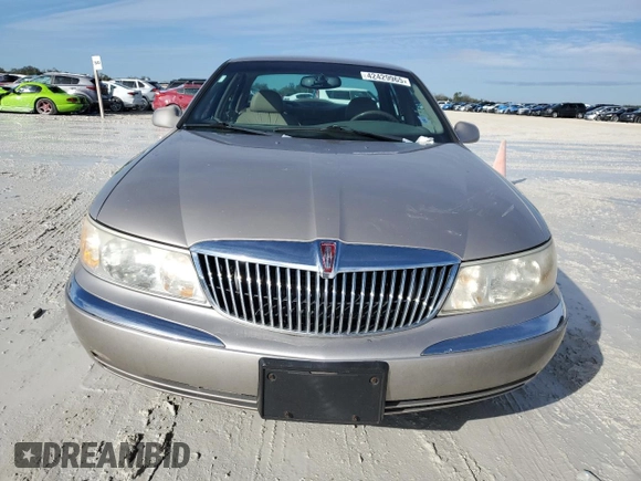1999 Lincoln Continental с VIN 1LNHM97V8XY671775, выставлен на аукционе Copart как лот 42429965 с пробегом 79 851 миль миль и Чистый • Clean title. История ставок и продаж доступна на DreamBid. Изображение 5.