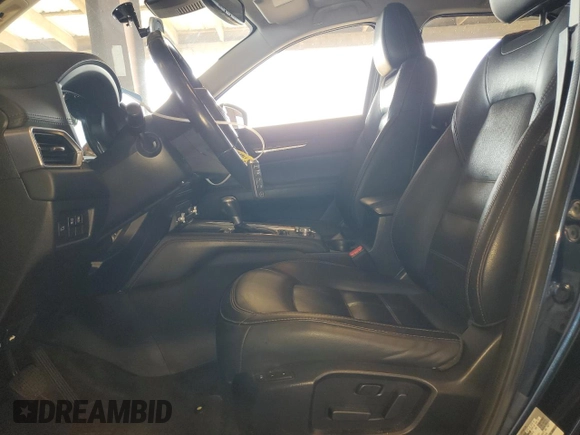 2019 Mazda CX-5 Grand Touring with VIN JM3KFADM3K1539890, listed as a Copart auction lot 57809835 with 56,079 mi miles and Salvage title. Bid and sale history available at DreamBid. Image 7.