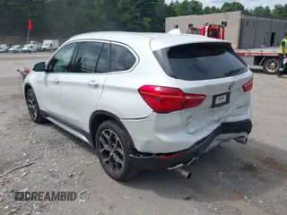 2021 BMW X1 xDrive28i with VIN WBXJG9C07M5U21337, listed as a IAAI auction lot 42590859 with 35,934 mi miles and . Bid and sale history available at DreamBid. Image 3.
