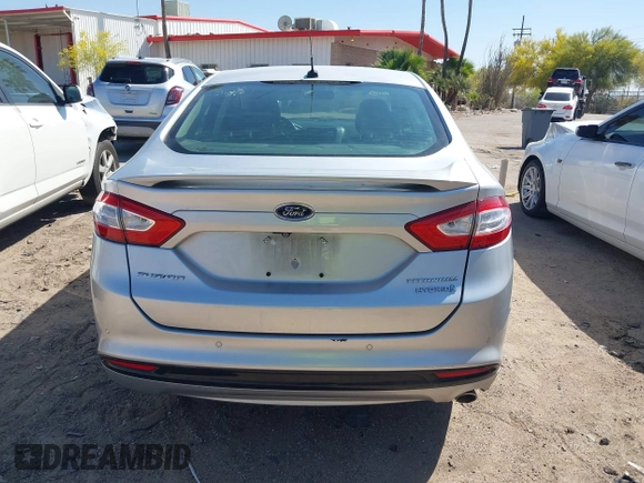 2014 Ford Fusion Titanium Hybrid with VIN 3FA6P0RUXER103516, listed as a IAAI auction lot 42004602 with 128,287 mi miles and . Bid and sale history available at carsss.com. Image 16.