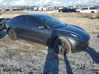 2023 Tesla Model 3 with VIN 5YJ3E1EAXPF704742, listed as a Copart auction lot 86323624 with 4,401 mi miles and Salvage Title. Bid and sale history available at carsss.com. Image 4.