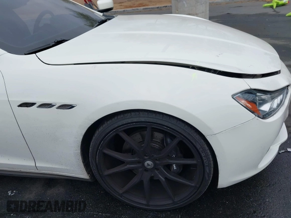 2014 Maserati Ghibli S Q4 with VIN ZAM57RTA3E1090350, listed as a IAAI auction lot 42056682 with 119,160 mi miles and . Bid and sale history available at DreamBid. Image 19.