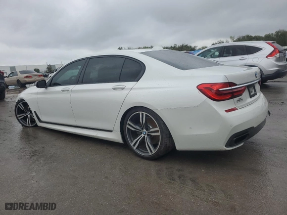2017 BMW 7 Series 750i with VIN WBA7F0C34HGM21478, listed as a Copart auction lot 48116435 with 76,617 mi miles and Salvage Title. Bid and sale history available at carsss.com. Image 2.