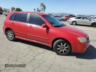 2005 Kia Spectra with VIN KNAFE162455069422, listed as a Copart auction lot 52999455 with 249,774 mi miles and Salvage Title. Bid and sale history available at carsss.com. Image 4.