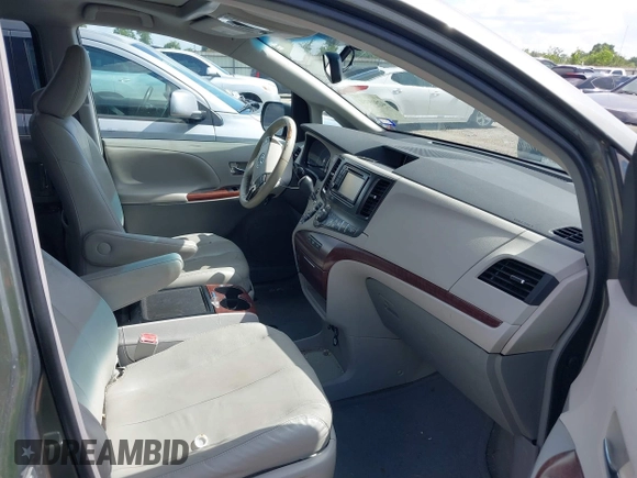 2014 Toyota Sienna XLE with VIN 5TDYK3DC2ES448876, listed as a IAAI auction lot 42519351 with 154,601 mi miles and . Bid and sale history available at DreamBid. Image 5.