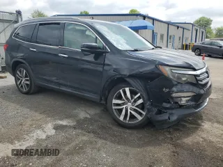 2017 Honda Pilot Touring with VIN 5FNYF6H90HB024321, listed as a Copart auction lot 57459895 with 134,244 mi miles and Salvage title. Bid and sale history available at DreamBid. Image 4.